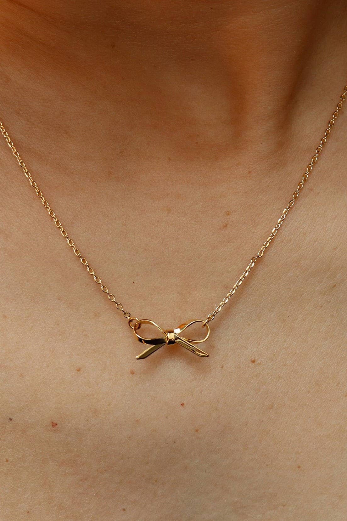 18K STAINLESS STEEL TARNISH FREE BOW NECKLACE: GOLD