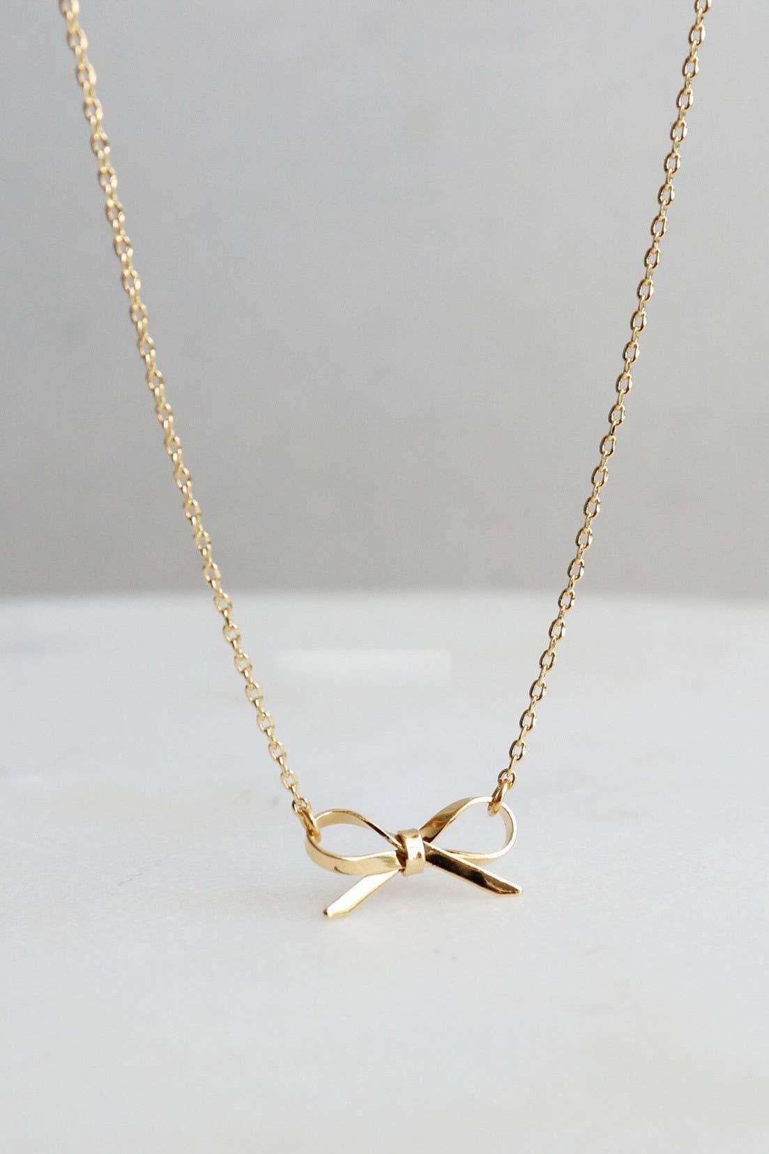 18K STAINLESS STEEL TARNISH FREE BOW NECKLACE: GOLD