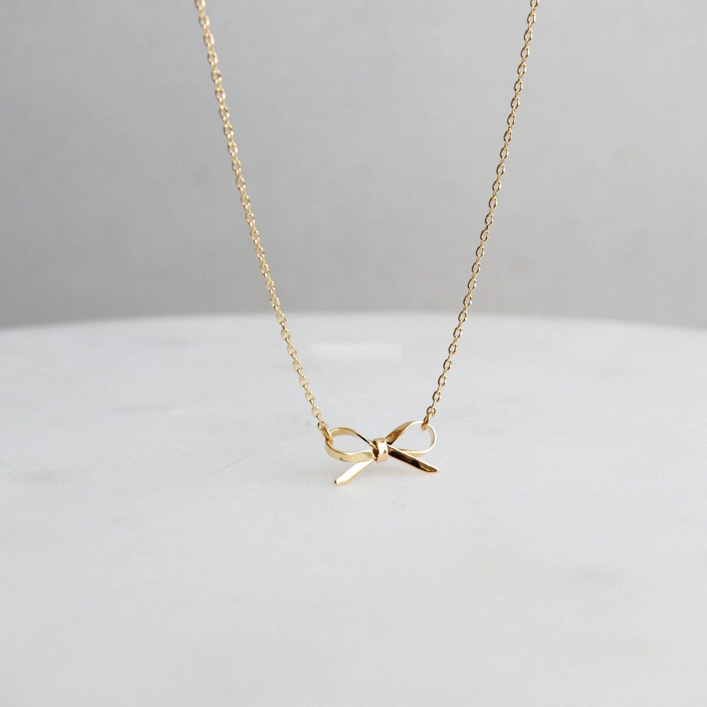 18K STAINLESS STEEL TARNISH FREE BOW NECKLACE: GOLD